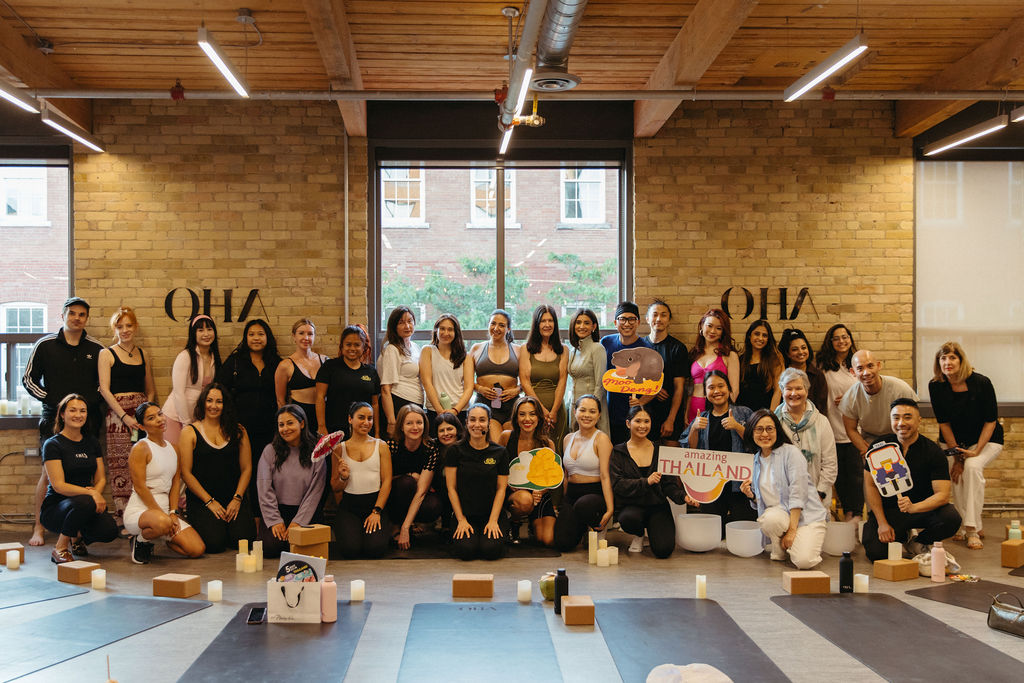 Group of professionals enjoying a wellness session at a corporate event organized by OHA Wellness.